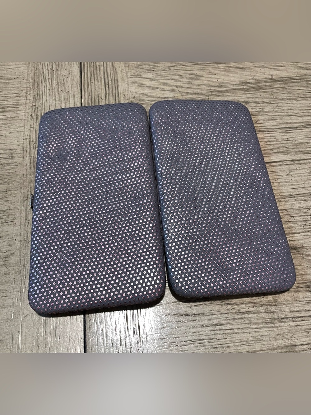 Women’s wallet, dark with purple polka dots.